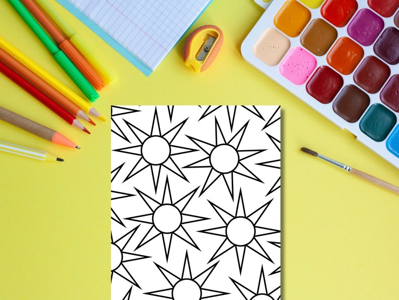May include: A black and white coloring page with a repeating pattern of stars. The page is surrounded by art supplies, including colored pencils, a pencil sharpener, a paintbrush, and a watercolor palette.