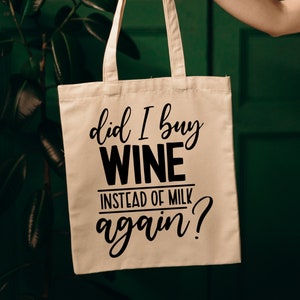 May include: A white canvas tote bag with black text that reads "Did I buy wine instead of milk again?"