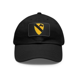 May include: A black baseball cap with a yellow and green patch featuring a horse head and the number "1" on a black background.