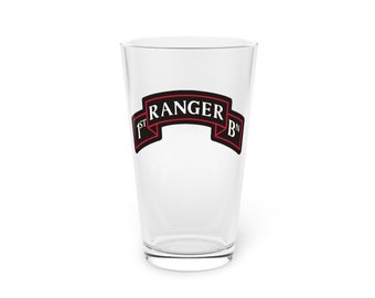 May include: A clear glass pint glass with a black and red 1st Ranger Bn. logo printed on the front.