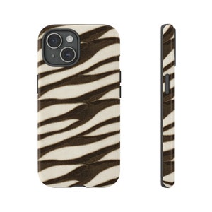 May include: A phone case with a zebra stripe pattern. The case features a cream-colored background with dark brown stripes. The case is shown from the front and side, showcasing the design and the phone's camera.