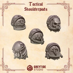 May include: Five gray tactical shoulder pads with various designs, including a skull, a sunburst, and ornate patterns. The text "Tactical Shoulderpads" is at the top. The GreyTide Studio logo is at the bottom.