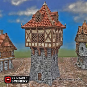 May include: A miniature model of a tall stone tower with a timber-framed upper level and a red tiled roof. The structure features a gray stone base, brown wooden beams, lattice windows, and a small arched door. The text PRINTABLE SCENERY is visible.