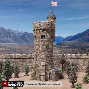 May include: A miniature stone tower model featuring a cylindrical structure with a crenelated top, a pointed roof, and a flag with a red cross. The tower has a small arched entrance at the base, multiple windows, and is surrounded by small model trees.
