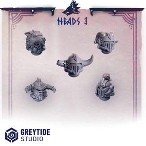 May include: A set of five grey miniature resin heads labeled Heads 3. The collection includes a wolf-themed helmet, a horned helmet, a helmet with side protrusions, a helmet with a top crest, and a helmet with a central horn and side spikes.