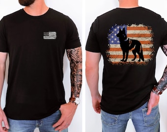 May include: Black t-shirt with a small American flag on the left chest and a larger American flag with a silhouette of a German Shepherd dog on the back.