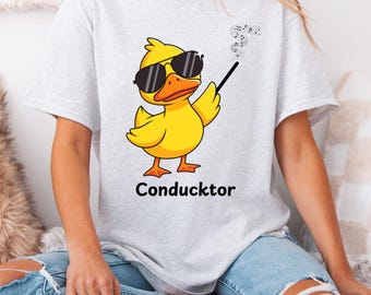Camiseta de director, camiseta de profesor de banda, ropa de director musical, pato musical, camiseta unisex de algodón grueso