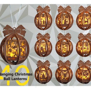 May include: Ten brown laser-cut wooden hanging Christmas ball lanterns with illuminated interiors. Each spherical ornament features a decorative bow at the top and intricate cut-out scenes including reindeer, snowflakes, and trees. Text reads 10 Hanging Christmas Ball Lanterns.