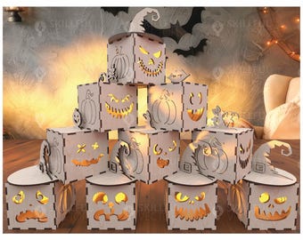 May include: Wooden Halloween-themed lanterns with carved pumpkin and witch hat designs. The lanterns are lit from within, creating a warm glow. The lanterns are stacked in a pyramid shape.