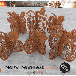 May include: A selection of laser-cut wooden pumpkin decorations in different designs. The pumpkins are a warm brown colour and feature intricate leaf and vine patterns. The image includes text that says "DIGITAL DOWNLOAD" and "Laser Cut File".