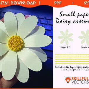 May include: A large paper daisy with white petals and a yellow center. The image includes instructions for assembling the daisy, with the text "Small paper Daisy assembly" and "Rolled center layers (Keep adding layers until you get the best shape)".