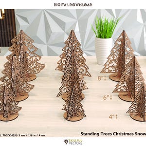 May include: Wooden Christmas tree decorations with snowflake cutouts. The trees are in various sizes: 4, 6, and 8 inches tall. The material thickness is 1/8 inch. The text on the image says "Standing Trees Christmas Snowflake".