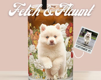May include: A white dog with blue eyes is featured on a glass tumbler with a floral design. The tumbler is filled with iced coffee. The text "Fetch & Flaunt" is at the top of the image. A smaller image of the dog is in the corner with the text "Customize it!"