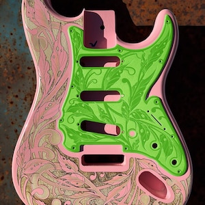 May include: A pink electric guitar body with a green and gold leaf design. The guitar body is blank and ready to be assembled. The text "DUSTSTORM ENGRAVING" is visible in the top right corner of the image.