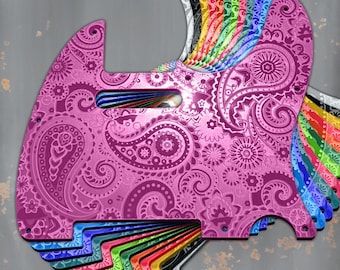 May include: A collection of guitar pickguards in various colors, including pink, black, white, yellow, green, and blue. The pink pickguard features a paisley design. The text "DUST STORM ENGRAVING" is at the bottom, with a "Proudly Made in USA" sticker.