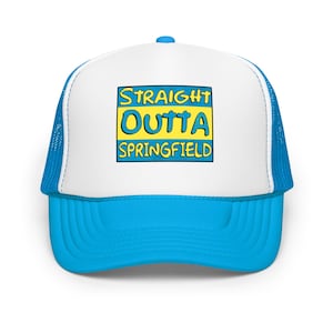 May include: A blue and white trucker hat with the text "STRAIGHT OUTTA SPRINGFIELD" in a yellow and blue design. The hat has a blue brim and mesh backing, and a white front panel.