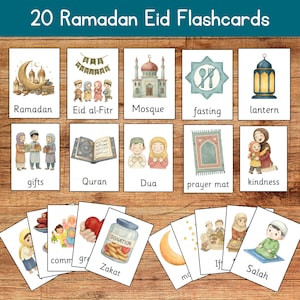 May include: A set of 20 Ramadan Eid flashcards. Each card features watercolor illustrations and text labels such as "Ramadan", "Mosque", "Fasting", "Gifts", "Quran", "Dua", "Zakat", and "Salah". The cards are arranged on a wooden surface.