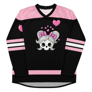 Front folded view of Lil Miss Mosh Pit cute pink and black jersey with skull and pink bow ties. Hockey long sleeve rave jersey for girls and edm lovers. Made of Recycled materials and made to order for sustainability!