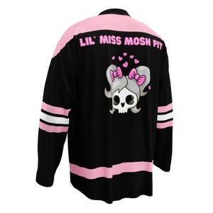 Lil Miss Mosh Pit cute pink and black jersey with skull and pink bow ties. Hockey long sleeve rave jersey for girls and edm lovers. Made of Recycled materials and made to order for sustainability