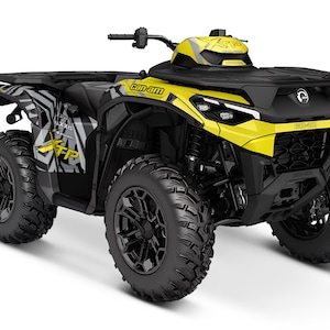 May include: A yellow and black Can-Am off-road vehicle with a black and grey graphic design. The vehicle has a black roll cage and black wheels with a black and grey spoke design.