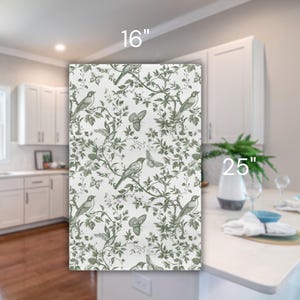 May include: A white kitchen backsplash with a green and white floral pattern featuring birds and butterflies. The backsplash is 25 inches tall and 16 inches wide.