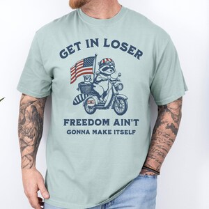 Funny Patriotic Raccoon Comfort Colors T-Shirt: 4th of July Gift Bay