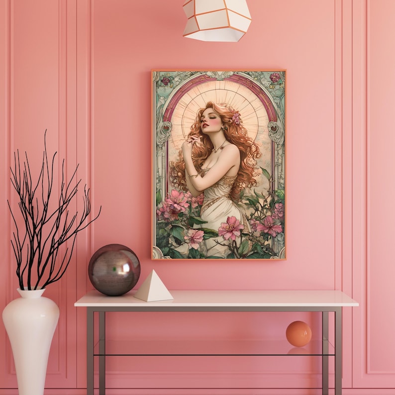 May include: A digital art print featuring a woman with long red hair standing in a garden with pink flowers. The woman is wearing a white dress and has a flower in her hair. The print is framed in a wooden frame.
