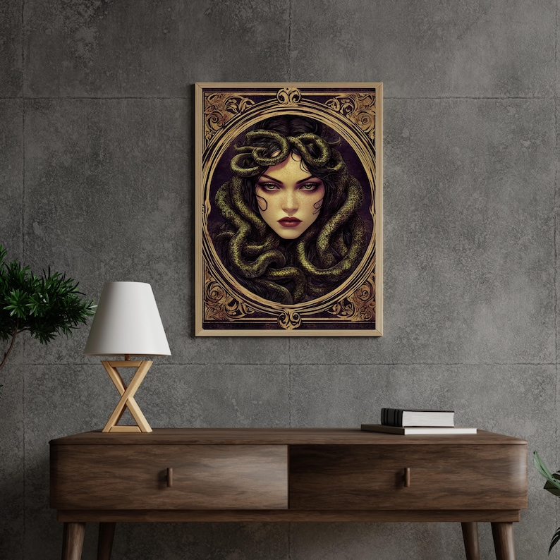 May include: A framed illustration of a woman with snakes for hair. The woman has dark hair and green eyes. The frame is gold with ornate details.