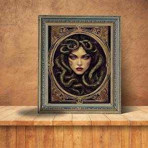 May include: A framed print of a woman with snakes for hair. The woman has a serious expression and is looking directly at the viewer. The print is in a gold frame with ornate details.