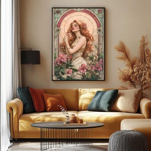 May include: A digital art print featuring a woman with long red hair, wearing a white dress and standing in a garden with pink flowers. The artwork is framed in a black frame and has a vintage aesthetic.