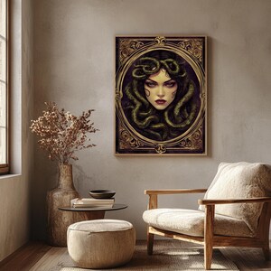 May include: A digital illustration of Medusa, a Greek mythological figure, with snakes for hair. Her face is framed by a gold ornate frame. The background is a dark purple.