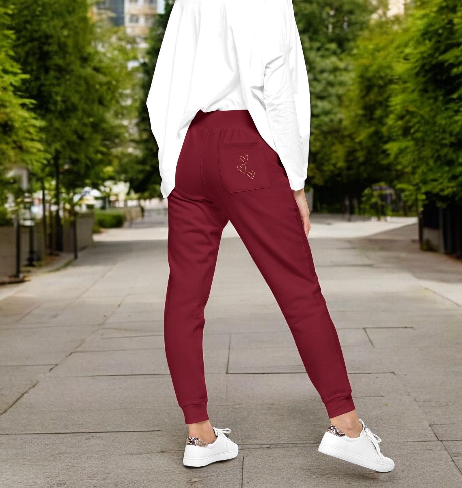 White joggers with black writing shop