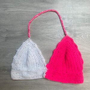 Pink and white halter neck crochet top.