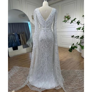 Elegant Pink Beaded Mermaid Evening Gown with Detachable Cape Sleeves