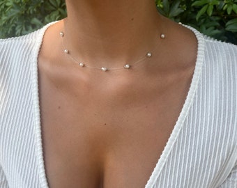 Floating choker pearl necklace