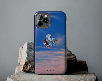 May include: A blue and pink phone case with a picture of two sneakers floating in the sky. The text "AIR" is printed on the bottom of the case.