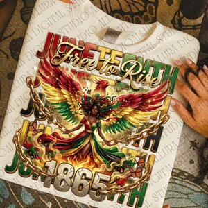 May include: Cream-colored sweatshirt featuring a vibrant graphic celebrating Juneteenth. The design includes a woman with colorful wings, chains, and the text "Juneteenth Free to Rise 1865th" in gold, red, green, and black.