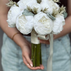 Detailed peony bouquet and boutonniere