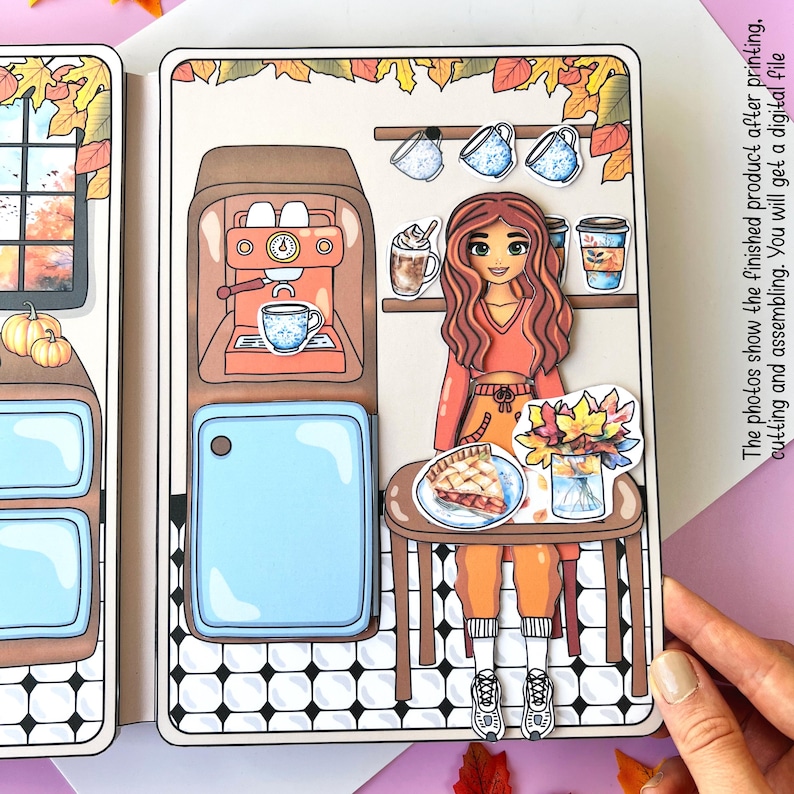 Pode incluir: Uma atividade de artesanato de papel imprim&iacute;vel com uma menina de cabelo castanho e uma camisa vermelha sentada &agrave; mesa com uma fatia de torta. A cena se passa em uma cafeteria com uma m&aacute;quina de caf&eacute;, uma geladeira e uma janela com folhas de outono do lado de fora.