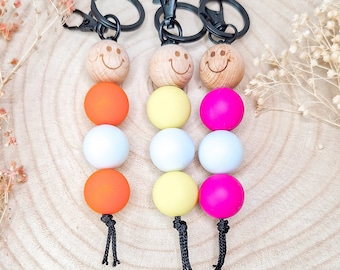 Keychain with large wooden bead with smiley and neon large silicone beads, with key ring and clip