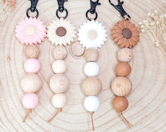 Key ring with large daisy, silicone beads and wooden balls, beige leather strap and black carabiner