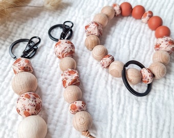 Keychain and key bracelet flowers, silicone beads wooden beads with black carabiner key ring