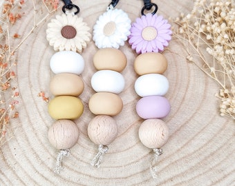 Keychain with large daisy, silicone beads and wooden balls, beige nylon strap and black carabiner