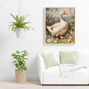 May include: A painting of a white duck standing in a field of white flowers. The duck is facing to the right and has its head turned to the left. The background is a blurry green and brown.