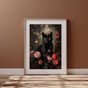 May include: A black cat sits in a lush garden setting, surrounded by pink, red, and white flowers. The cat has green eyes and is looking directly at the viewer.