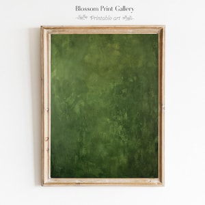 May include: A framed print with a textured, dark green abstract design. The frame is a light wood color. The text "Blossom Print Gallery" and "Printable art" are at the top of the frame.