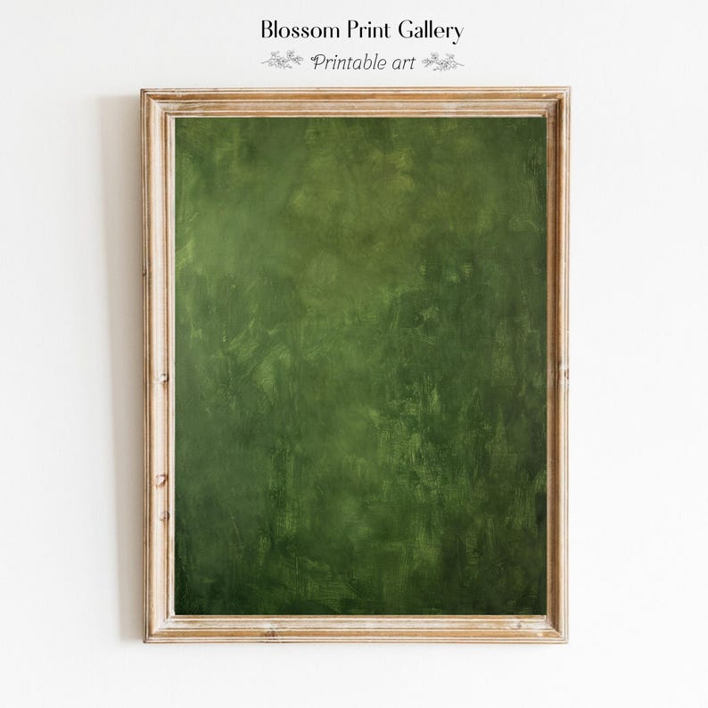 May include: A framed print with a textured, dark green abstract design. The frame is a light wood color. The text "Blossom Print Gallery" and "Printable art" are at the top of the frame.