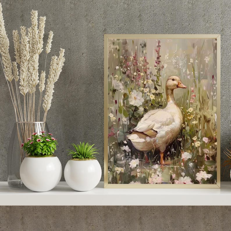 May include: A painting of a white duck standing in a field of flowers. The duck is facing the right side of the image and has a light brown beak. The flowers are a variety of colors, including pink, purple, and white. The background is a soft, muted green.
