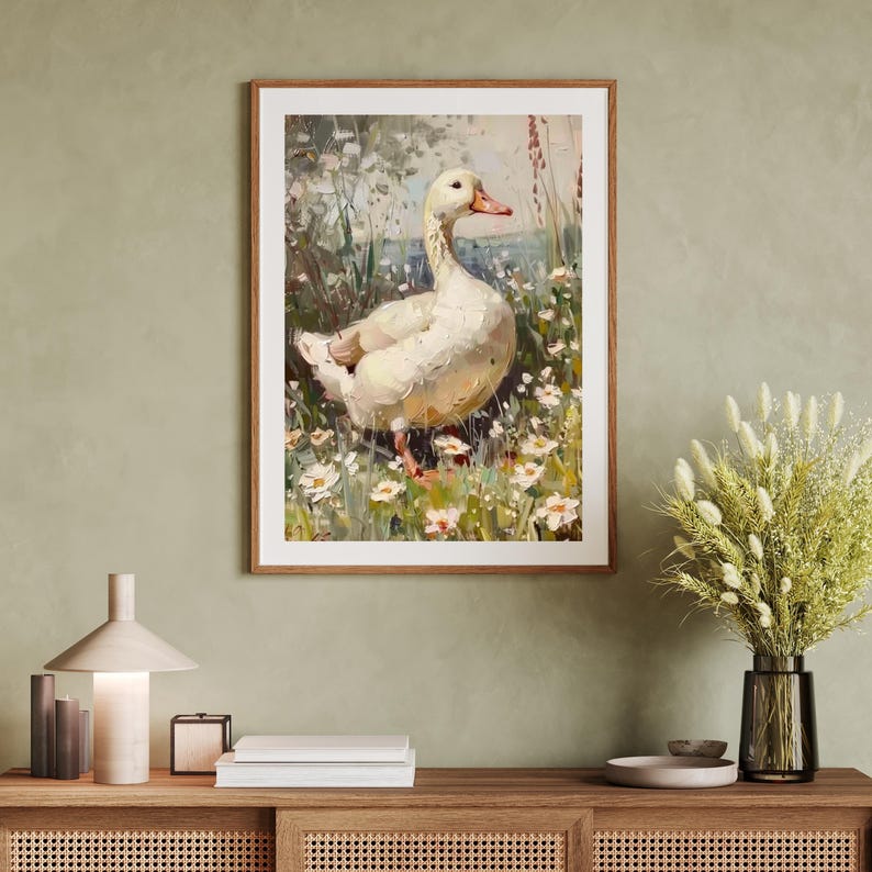 May include: A painting of a white duck standing in a field of white flowers. The duck is facing to the right and has its head turned to the left. The background is a blurry green and brown.