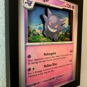 May include: A Gengar Pokemon card from the Pokemon Trading Card Game. The card is purple and features an illustration of Gengar, a ghost-type Pokemon. The card's text reads "Poltergeist" and "Hollow Dive".
